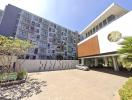 Modern residential building with parking facilities and lush greenery