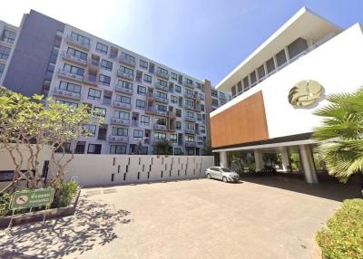 Modern residential building with spacious entrance and parking area