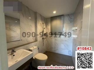 Modern bathroom interior with marble tiles and natural lighting