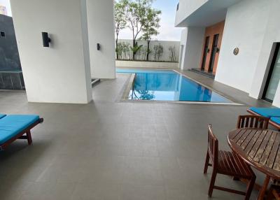 Modern building interior with pool and sitting area