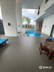 Modern building interior with pool and sitting area