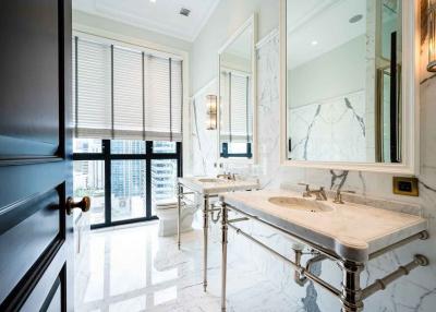 Elegant marble bathroom with double vanity and large mirrors