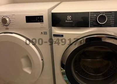 Modern laundry appliances in a well-maintained room