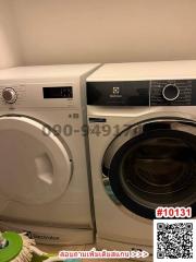 Modern laundry appliances in a well-maintained room