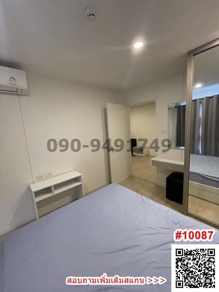 Modern bedroom with air conditioning and built-in wardrobe