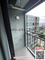 Compact balcony with urban view and sliding glass door