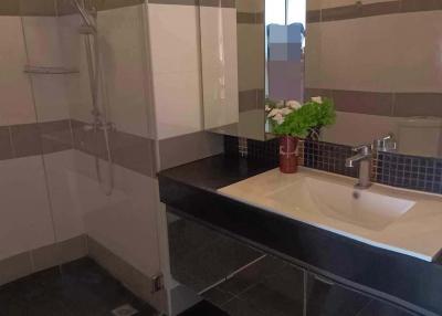 Modern bathroom with walk-in shower and large mirror