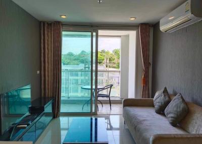 Bright living room with large window and balcony access