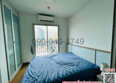 Spacious Bedroom with Large Bed and Balcony Access