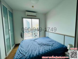 Spacious Bedroom with Large Bed and Balcony Access
