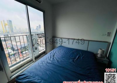Cozy Bedroom with Large Window and City View