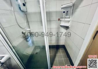 Compact bathroom with shower and water heater