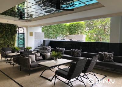 Stylish patio with seating area and greenery