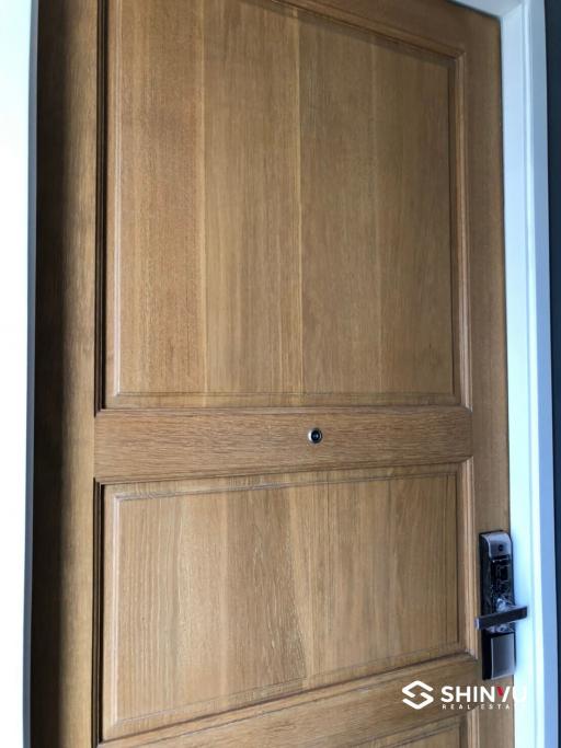 Close-up view of a wooden door with a lock