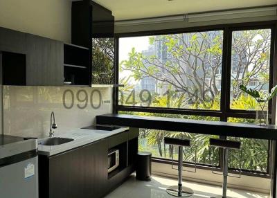 Modern kitchen with large windows and city view
