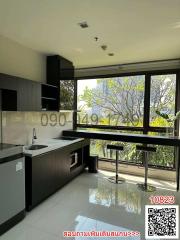 Modern kitchen with large windows and city view