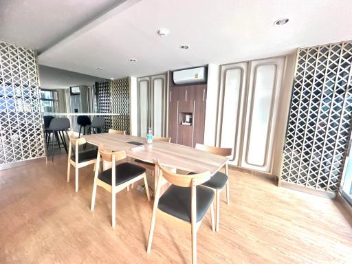 Spacious dining area with wooden floor and decorative lattice panels