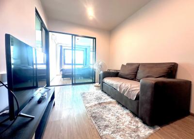 Modern living room with large windows and balcony access