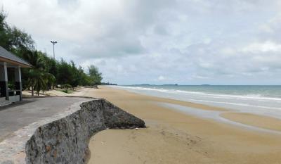 Serene beachfront view adjacent to property with clear skies