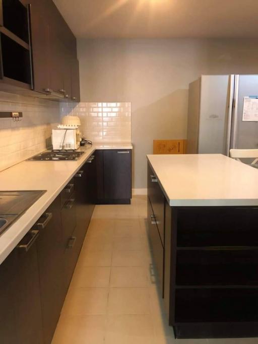 Modern kitchen with stainless steel appliances and white subway tile backsplash