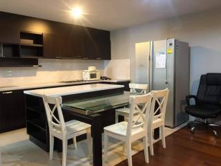 Modern kitchen with large refrigerator and breakfast bar