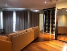 Spacious living room with modern furnishings and hardwood flooring