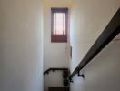 Bright staircase with window and handrail