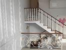 Elegant white staircase with decorative railing in a modern home