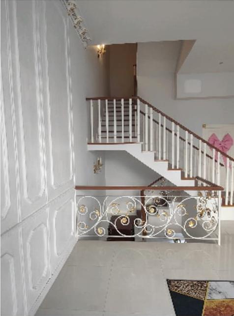 Elegant white staircase with decorative railing in a modern home