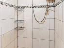Tiled bathroom shower area with wall-mounted water heater
