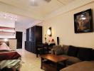 Cozy bedroom with adjoining living space equipped with comfortable furniture and modern amenities