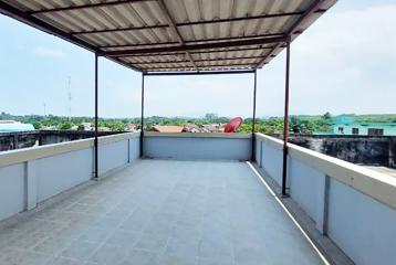 Spacious rooftop terrace with surrounding views and protective railing