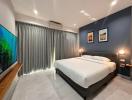 Modern bedroom with king-sized bed, LED lighting, and air conditioning