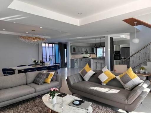Elegant living room with open-plan kitchen design