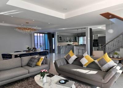 Elegant living room with open-plan kitchen design