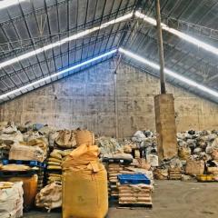 Spacious warehouse with high ceiling and storage sacks
