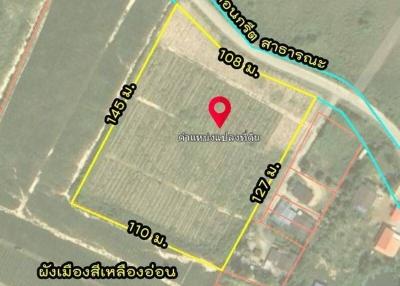 Aerial view of a land plot with property boundaries and measurements