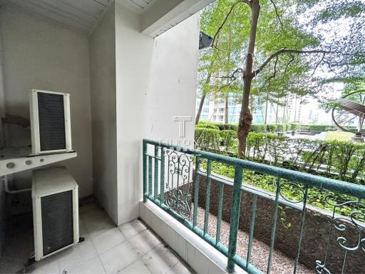 Cozy apartment balcony overlooking green area