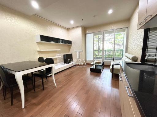 Modern kitchen with dining table set near window