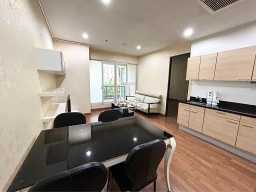 Modern kitchen with adjacent dining area and living space