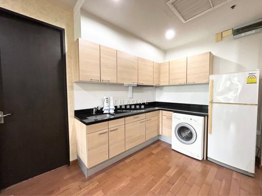 Modern kitchen with wood cabinets and built-in appliances