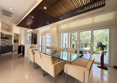 Modern kitchen with dining area and garden view