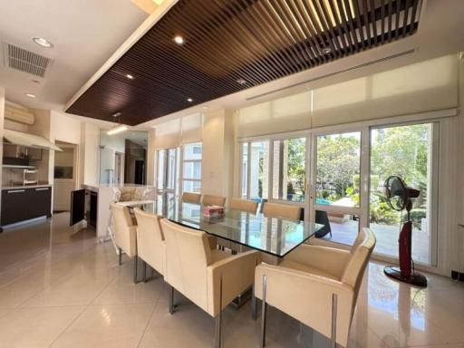 Modern kitchen with dining area and garden view