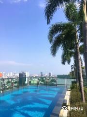 Luxury rooftop swimming pool with city skyline view