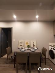 Modern dining area with adjacent laundry appliances