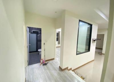 Spacious interior view showing hallways and entrance to modern bathroom