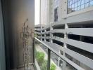 Urban apartment balcony with a view of neighboring buildings