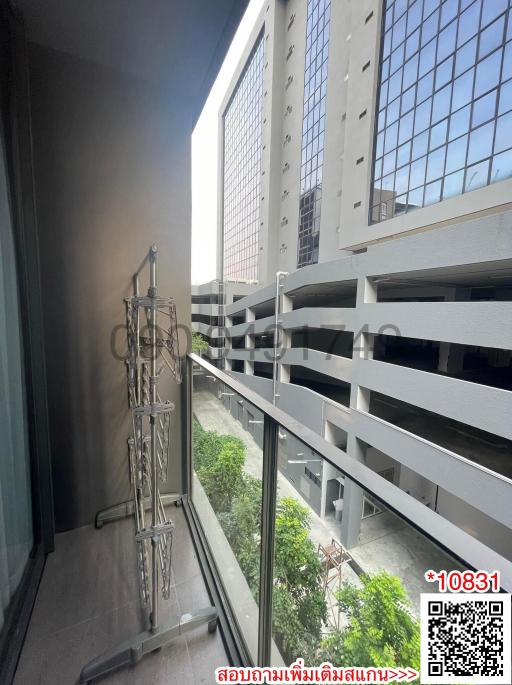 Urban apartment balcony with a view of neighboring buildings