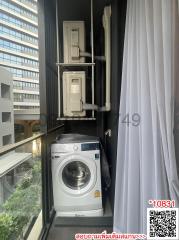 Compact laundry area with a washing machine and stacked dryer