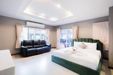 Modern bedroom with king-sized bed and elegant furnishings